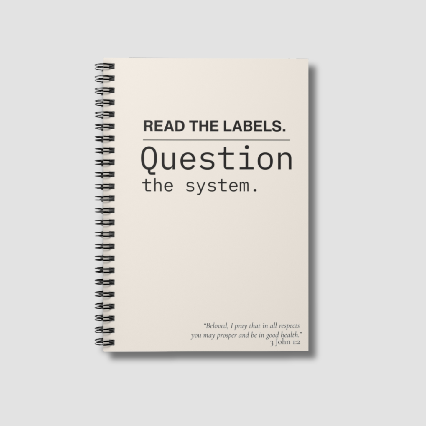 Notebook — "Read the Labels. Question the System." Spiral Ruled Journal - Cream